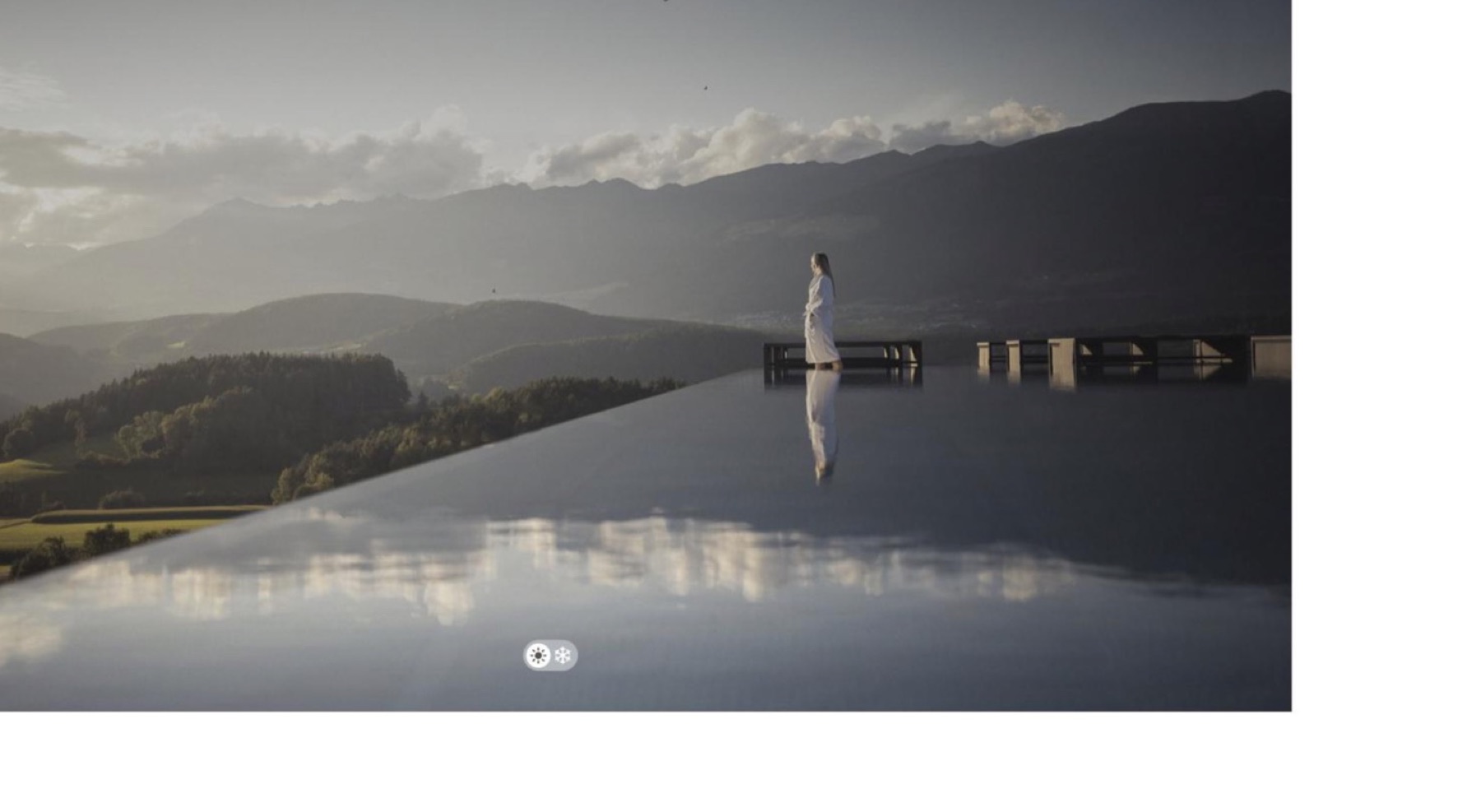 The live winklerhotels.com hero on load: a full-bleed photograph of an infinity pool facing the Dolomites, with no booking field or date picker inside the hero
